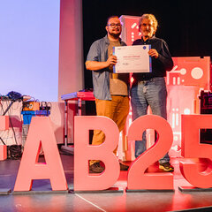 Mika Günther receives his diploma from MIT Professor Gershenfeld