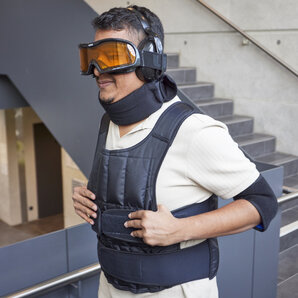 A student is wearing an age simulation suit.