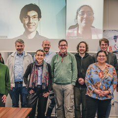Visible online or on screen (from left to right): Jordan Schneider (HBRS), Prof. Dr Teena Hassan (HBRS)  In attendance (from left to right): Prof. Dr Benedikt Janßen (HSNR), Anne Ferger (UDE), Prof. Dr Thomas Nitsche (HSNR), Prof. Dr Nele Wild-Wall (HSRW), Prof. Dr Bernhard Breil (HSNR), Prof. Dr Christian Ressel (HSRW), Dr André Krause (HSRW), Iman Awaad (HBRS), Michael Stolarz (HBRS), Barbara Arntz (HSRW)